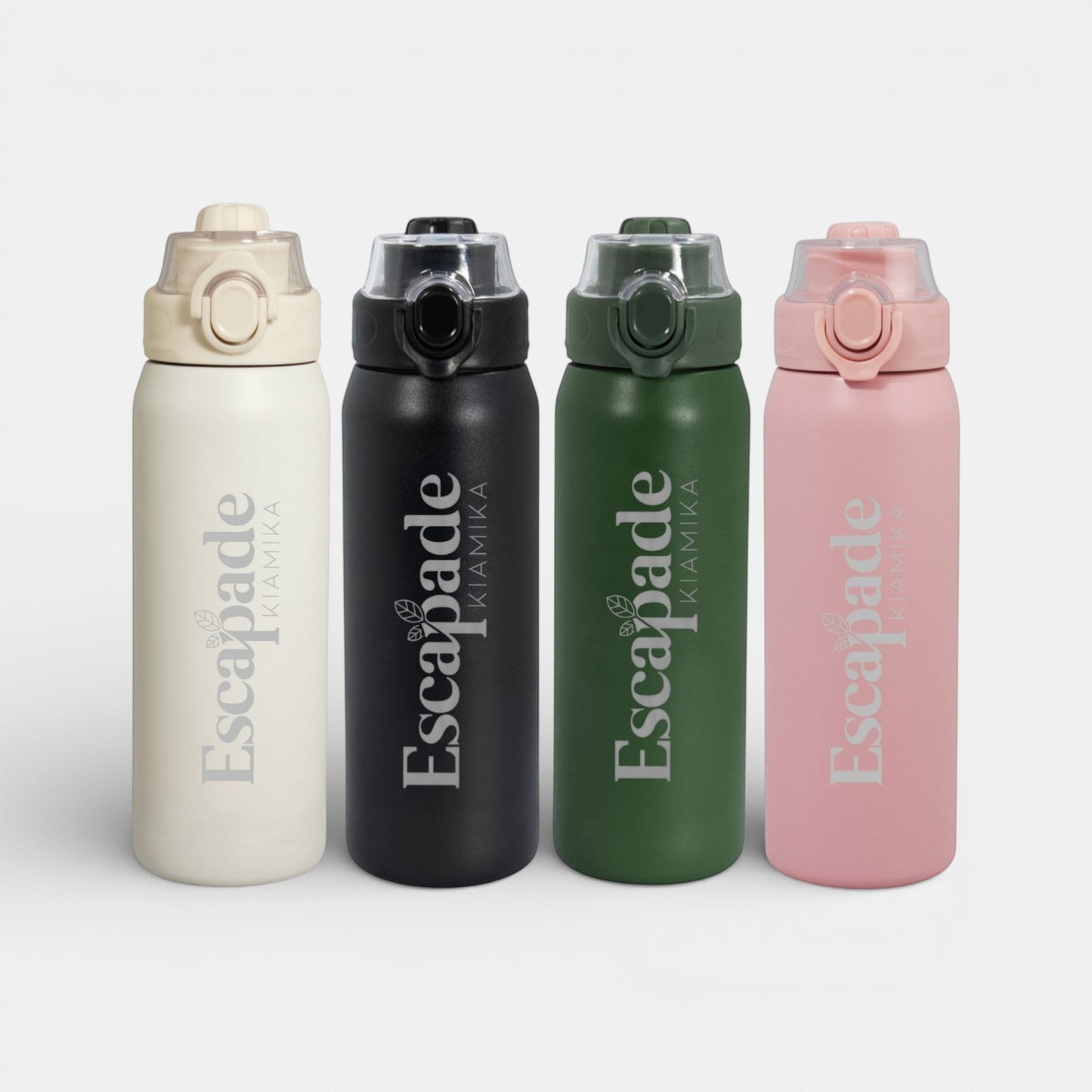 Impression M Alexis 2067 stainless steel vacuum insulated water bottles in beige, black, green, and pink with lids.