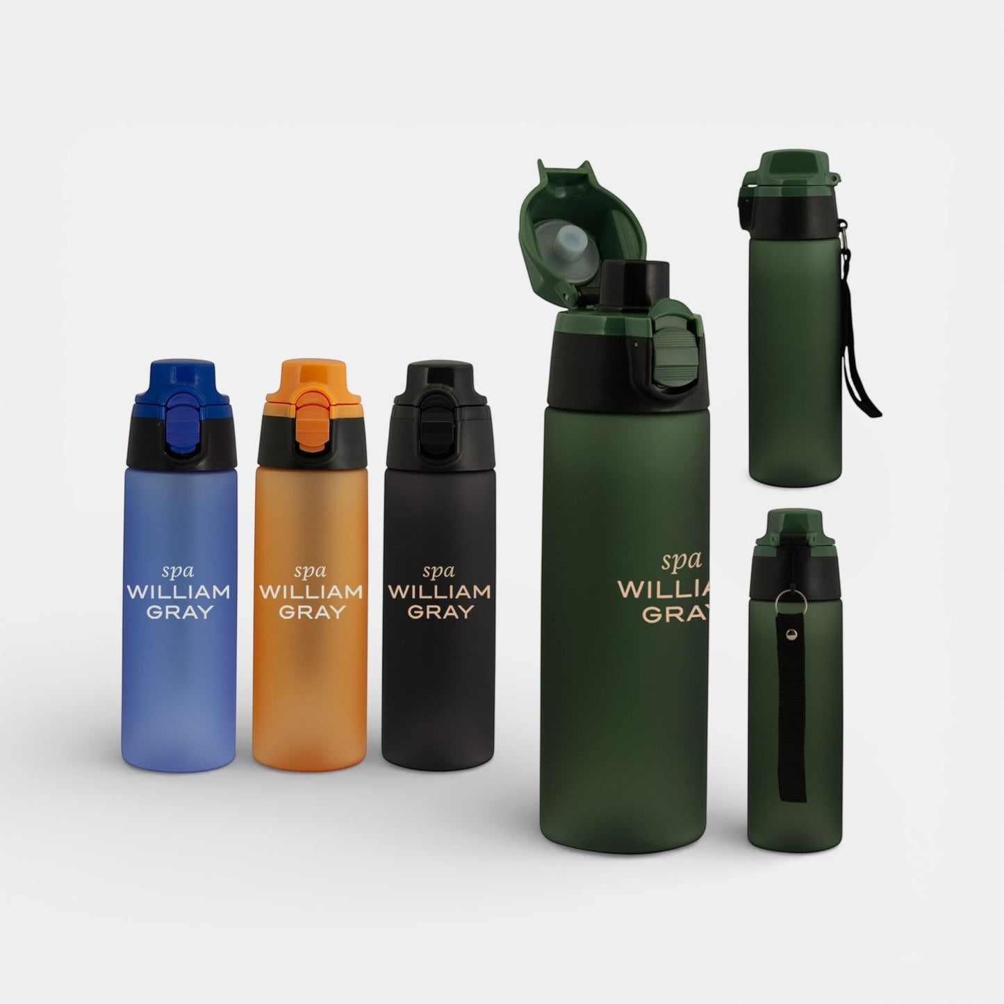 Impression M Julio Tritan 750ml sport bottles in various matte colors with custom branding and flip-top lids.